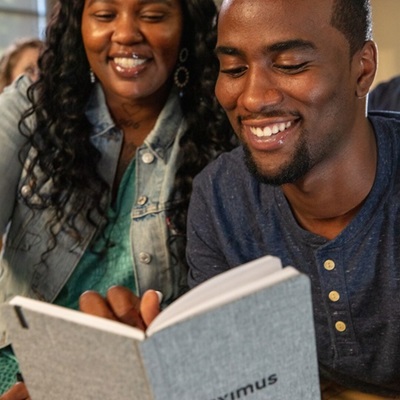 Two employees reading a document